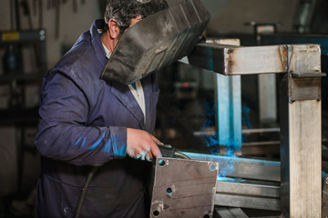 Professional welder in working process