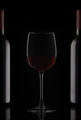 Bottles and glass of red wine