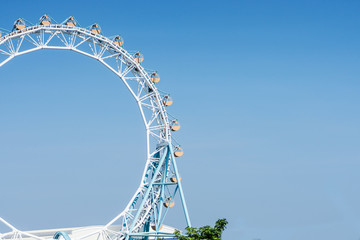 Ferris wheel with blue sky