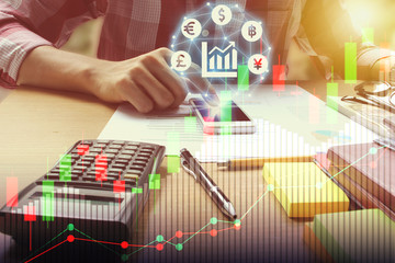 Double exposure of man use smartphone interface of Fintech and Calculator on the office desk with stock market or financial graph for financial investment concept