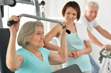 people  exercising in gym