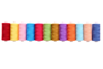 A colorful spool with threads often used in tailoring and is an indispensable element of this profession.
