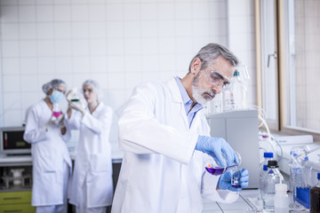 Scientist working with liquid in lab