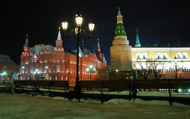 Obraz premium View of the Historical Museum near red Square at night. Moscow, Russia/ In Gothic style, of red brick. Taken late evening, before Christmas, festive illumination and decoration of the city