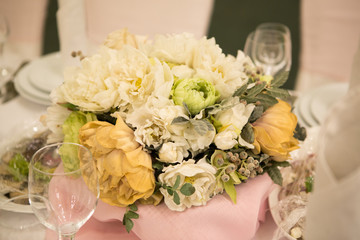 Flowers on wedding table. bouquet of white peonies on the wedding table