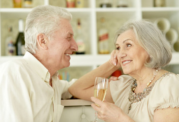 mature couple drinking champagne