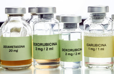Vials of different size with medication used for neurodegenerative diseases, conceptual image