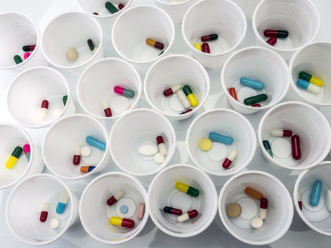 Daily medication at a hospital table, conceptual image