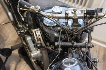 Old motorcycle with manual gearing.