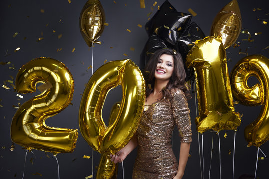 Excited woman celebrating new year 2019