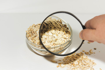 in a glass bowl of cereal, closeup under a microscope, magnifying glass, soul food, space for text.