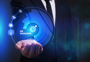 Business, Technology, Internet and network concept. Young businessman working on a virtual screen of the future and sees the inscription: HR manager