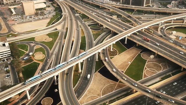 View of a busy highway intersection in Dubai, UAE, at daytime. Travel and transportation concept. 