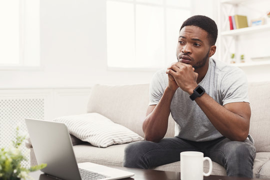 Thoughtful Young African-american Man At Home