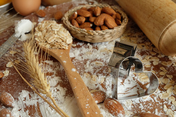 Cake making equipment. wooden rolling pin and Various wooden on brown table.