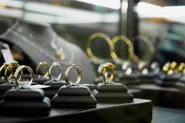 Jewelry diamond rings and necklaces show in luxury retail store window display