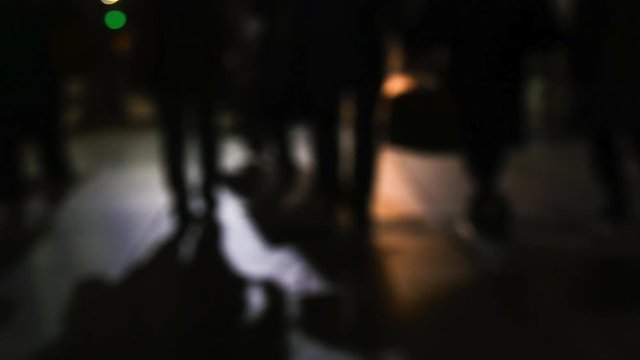 Timelapse view of busy people in a city night.