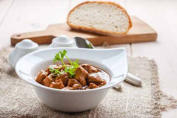 Goulash soup with pork and mushrooms.