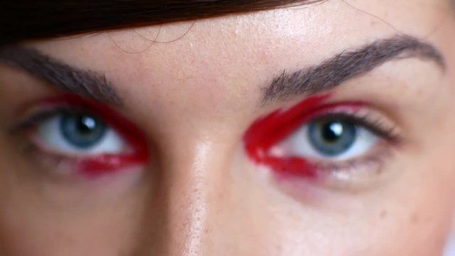 Close-up of beautiful female eyes with bright make-up