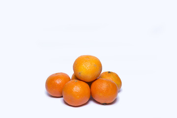 Citrus fruits (tangerines) isolated on white background with shadows