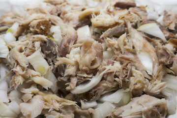 Smoked fish with onion and olive oil. Delicious dish. Fabulous taste. Selective focus.