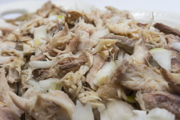 Smoked fish with onion and olive oil. Delicious dish. Fabulous taste. Selective focus.