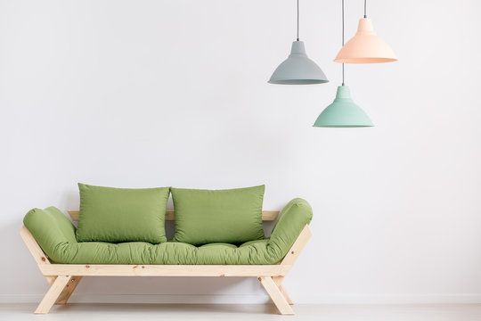 Wooden Sofa With Green Pillows