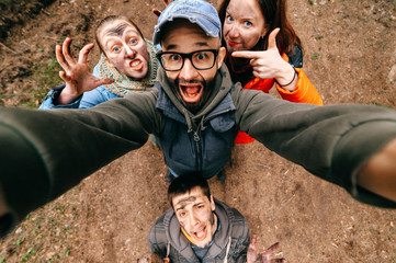 Four crazy funny people selfie. Bizarre scary company mess outdoor. Disgusting creepy fellows...