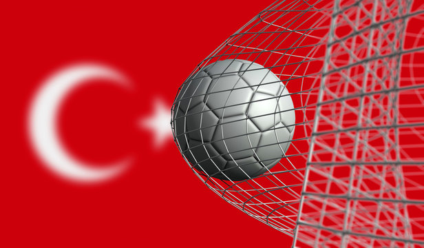Soccer ball scores a goal in a net against Turkey flag. 3D Rendering
