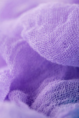 Fototapeta na wymiar Closeup of hand dyed gauze fabric purple color. Ultra violet trendy color concept