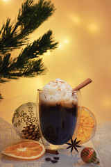 Christmas composition with thermo glass cup of tasty coffee topped with frothy milk and cinnamon powder served on reflective surface 2