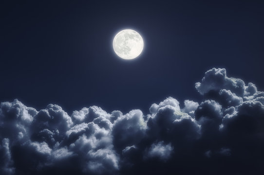 cloudscape at night with full moon