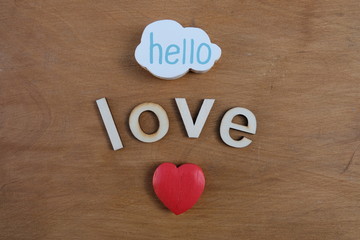 Hello Love with wooden letters and red heart 