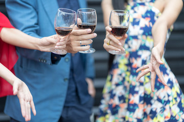 Red wine Christmas party concept. Happy new year coming soon.People celebrating happy drinks with friends