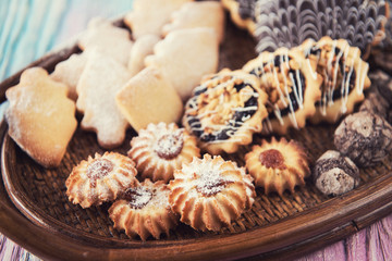 Tasty different cakes set on a color gradient background