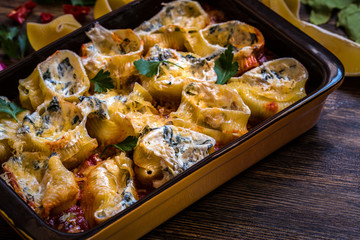 shell pasta stuffed with spinach, cream cheese, Parmesan in tomato sauce with garlic