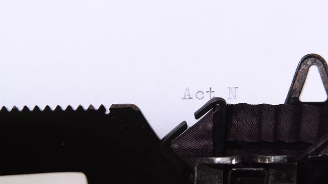 Word is act no , printed on a piece of paper. Close up