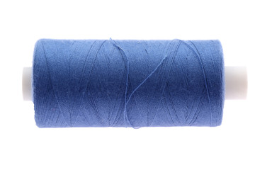 A colorful spool with threads often used in tailoring and is an indispensable element of this profession.
