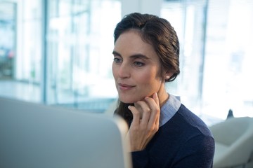 Female executive working on computer