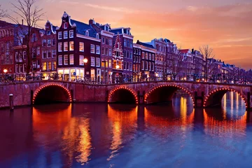 Deurstickers Amsterdam by night in the Netherlands © Nataraj