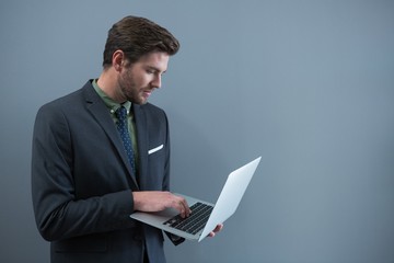 Businessman using laptop in office