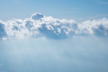 Blue sky with white clouds and ray of sun light using as background or wallpaper.