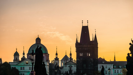 Fototapeta premium Sunset over Charles Bridge and Prague, Czech Republic