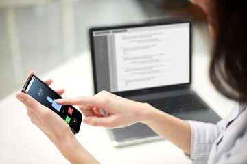 close up of woman with smartphone at office