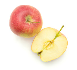Apple (Evelina variety) isolated on white background top view one whole and one cross section half.