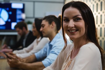 Female executive relaxing in conference room