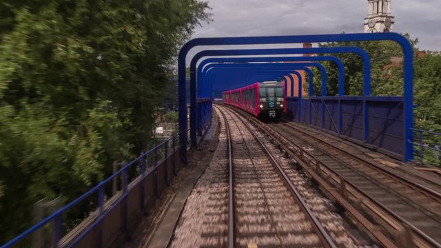 canary wharf in london, POV shot from the moving docklands light railway.
