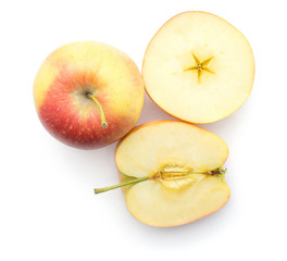 Sliced apples (Evelina variety) top view isolated on white background one whole one half and one...