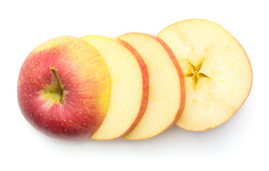 Sliced apple (Evelina variety) top view isolated on white background four pieces.