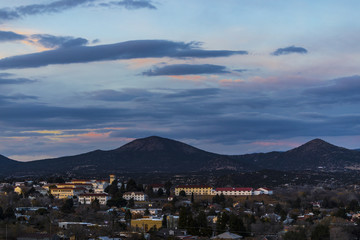 Last light falls on a small college town nestled in the mountains  - 185393921